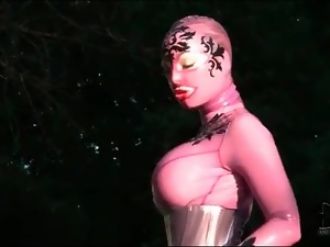Corset and rubber catsuit on big tits babe