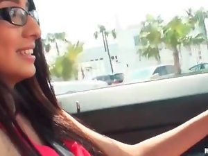 Glasses girl driving car and flashing her tits