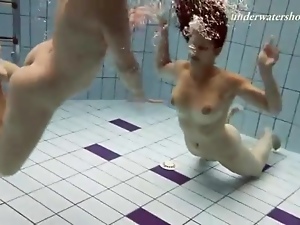 Naked girls swim underwater and look sexy
