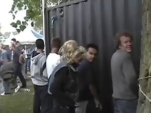 Attractive Dutch lady peeing in public at festival