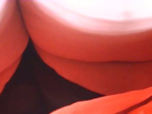 close upskirt of wench in red dress