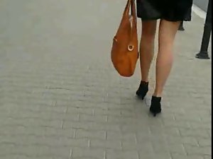 Candid #81 Young woman with sensual legs in mini skirt and high heels