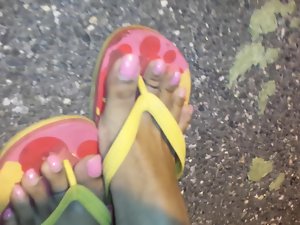 Comely feet in flip flops