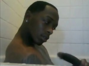 Long black schlong in bathtub