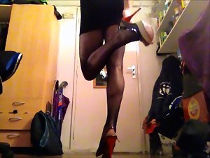 Sexual Sasha in black dress, fishnet pantyhose and high heels