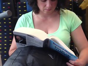 Cougar reading on train