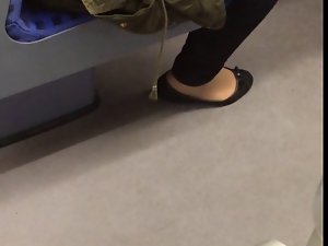 Flats with pantyhose shoeplay in the train