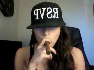 Lewd sexual chick smoking 2 cigars at the same time!